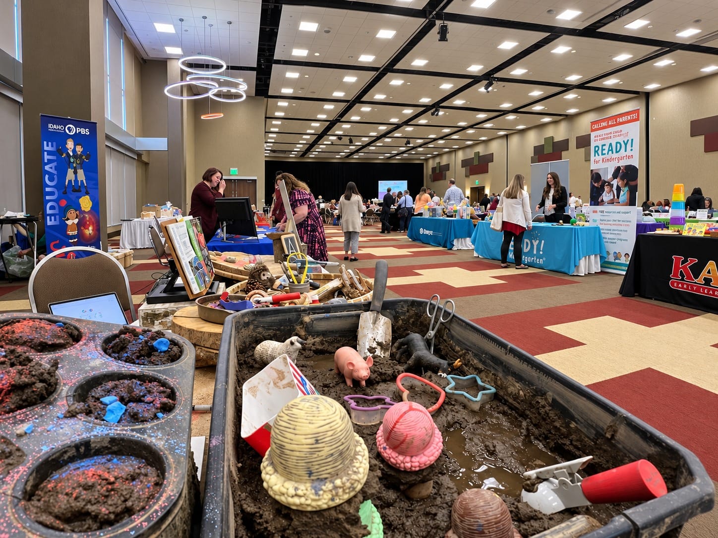 Mud kitchen play materials displayed at an early childhood education event